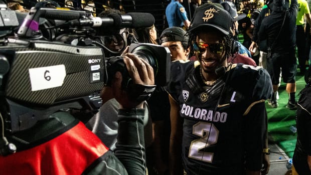 CU football's junior quarterback Shedeur Sanders is all smiles while being interviewed on ESPN after a thrilling overtime victory against CSU in the Rocky Mountain Showdown on Sept. 16, 2023 at Folsom Field in Boulder, Colo